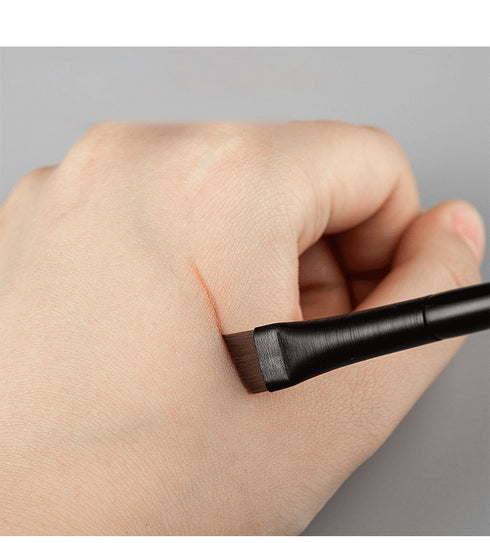 angled tinting brush drawing a line